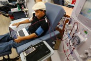 In this photo taken Monday, Sept. 24, 2018, Adrian Perez undergoes dialysis at a DaVita Kidney Care clinic in Sacramento, Calif. If approved by voters in November, Proposition 8, would limit dialysis clinics' profits. (AP Photo/Rich Pedroncelli)